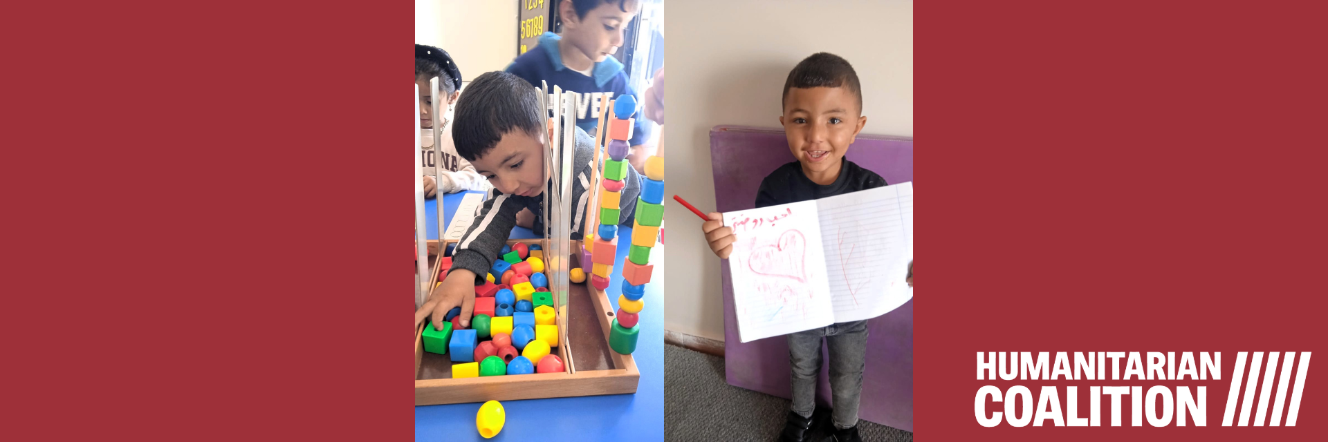 A boy plays with blocks and another boy holds up a picture of a heart he drew