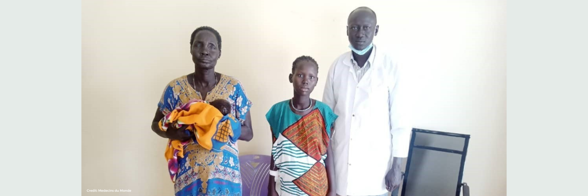 Picture of Nyajima and her caretaker with a doctor