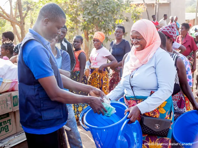 Photo of Elifa receiving the aid