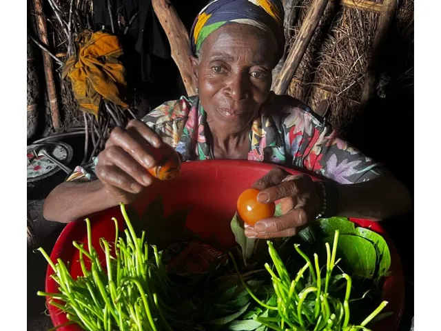 Angela interviewed by a world vision humanitarian staff worker