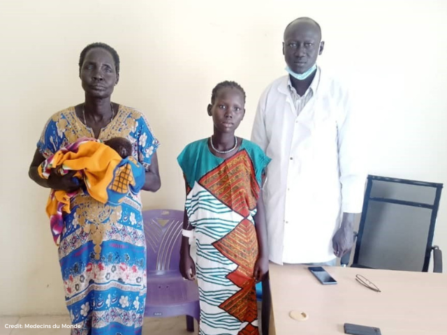Picture of Nyajima and her caretaker with a doctor